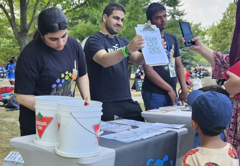 Splash on Earth volunteers sharing information at a community event